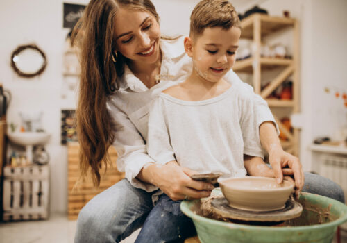 Mother with son at a pottery class